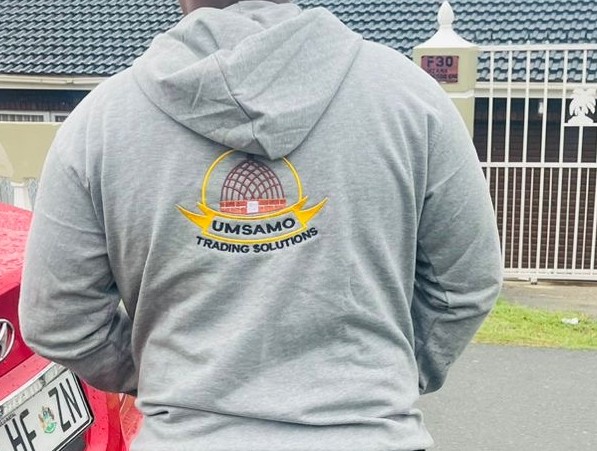 Grey hoodie with Umsamo Trading Solutions embroidery